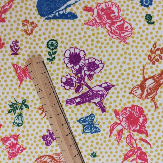 tissu coton imprimé Nathalie Lété animaux de la forêt et fleurs idéal pour la couture créative fond pois jaune oiseaux sur la branche violet papillon bleu