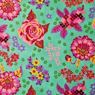 tissu en coton imprimé motif floral Nathalie Lété fleurs colorées roses, violettes mauves sur fond vert menthe